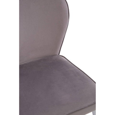 Close up of grey velvet dining chair seat and curved backrest