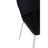 Black velvet dining chair with chrome legs, partial close-up of seat and back