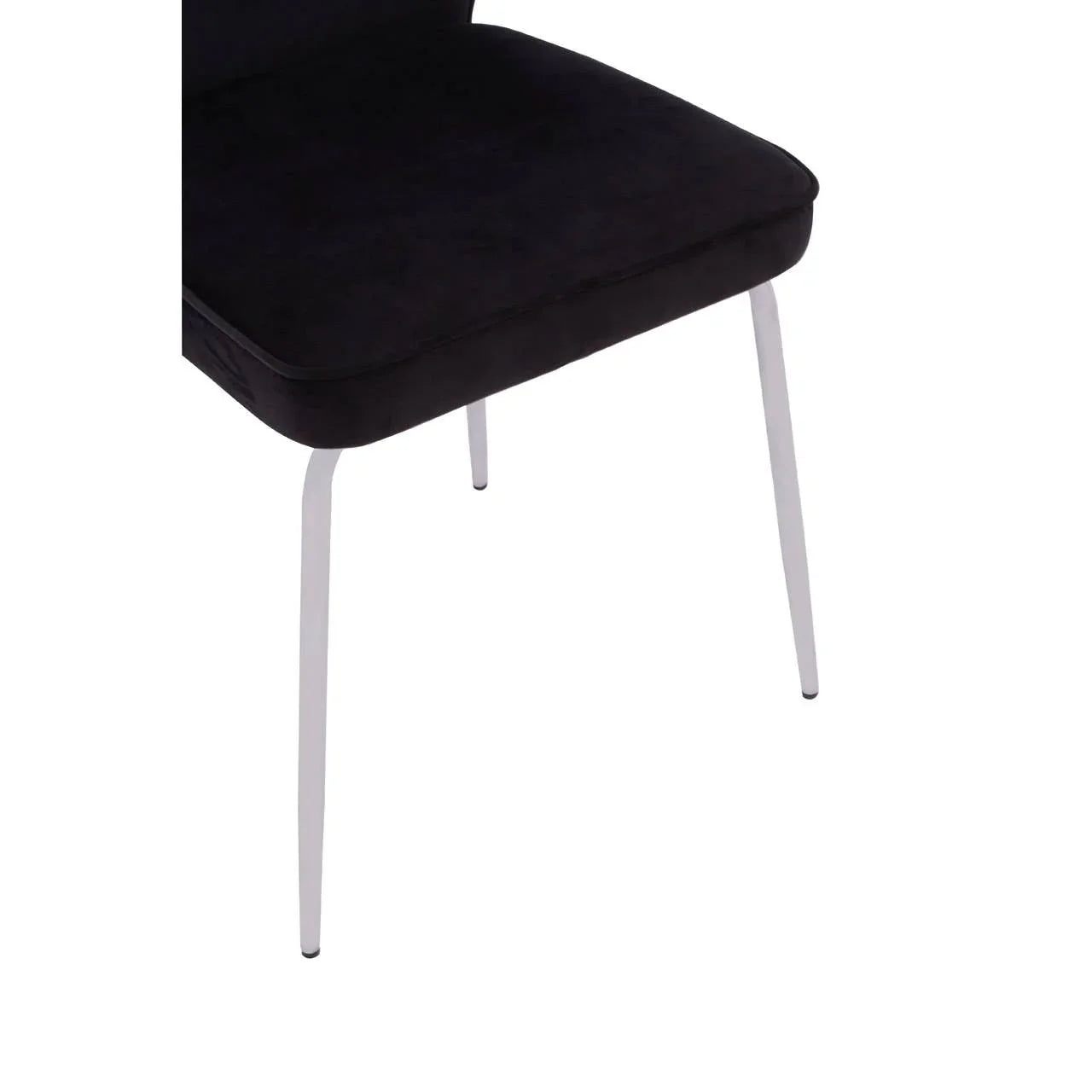 black velvet dining chair with slim white legs, side angle view