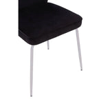 black velvet dining chair with slim white legs, side angle view