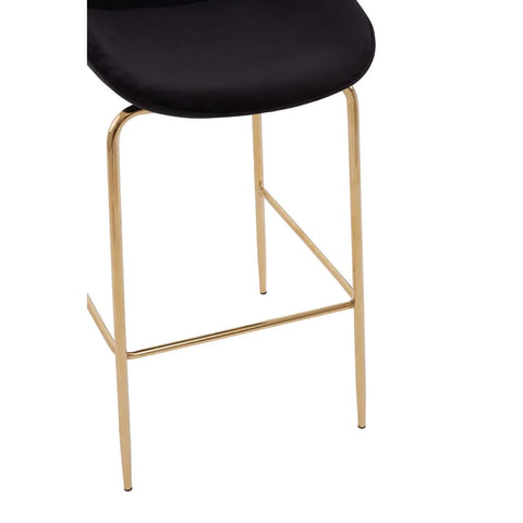 Black velvet bar stool seat with gold metal legs, close-up front angle