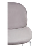 Close-up of grey velvet dining chair with chrome legs