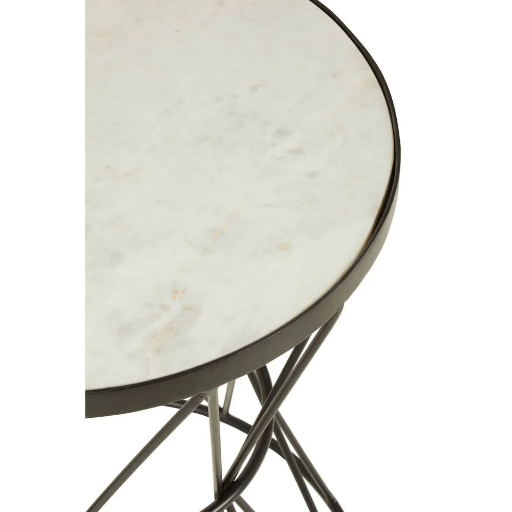 Round marble side table with black metal frame, close-up of tabletop and base detail