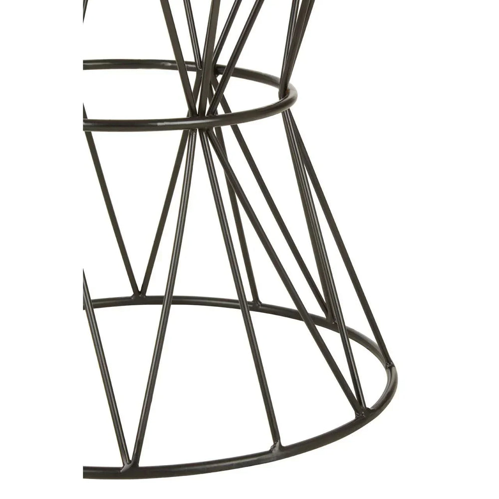 Black metal wire dining table base with geometric design, close up view