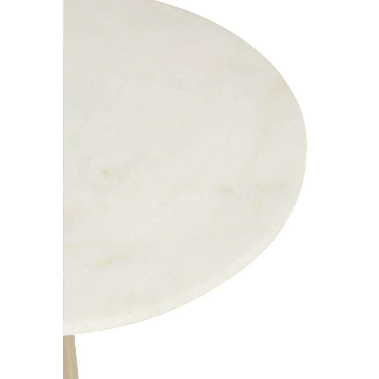 Round marble table top with subtle veining, close view