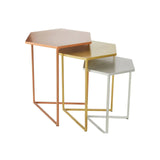 Set of three hexagonal metal nesting tables in copper, gold and silver finishes