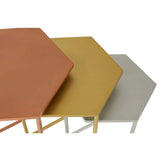 Set of three hexagonal nesting tables in orange, yellow, and grey metal finish