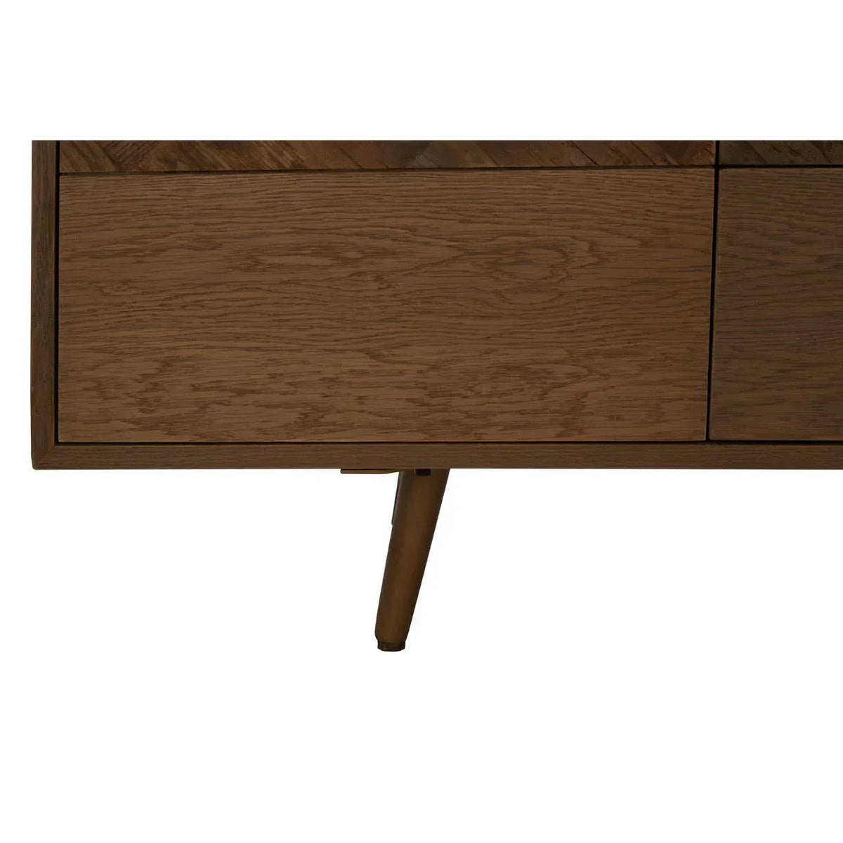 Closeup of oak sideboard with natural wood grain and angled mid-century leg