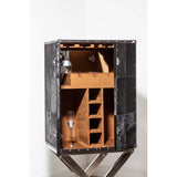 A drinks cabinet featuring a hair-on leather exterior with a cross base design, showcasing an open interior with wooden shelving and compartments for storage. The cabinet is positioned against a white wall, highlighting its unique texture and structure