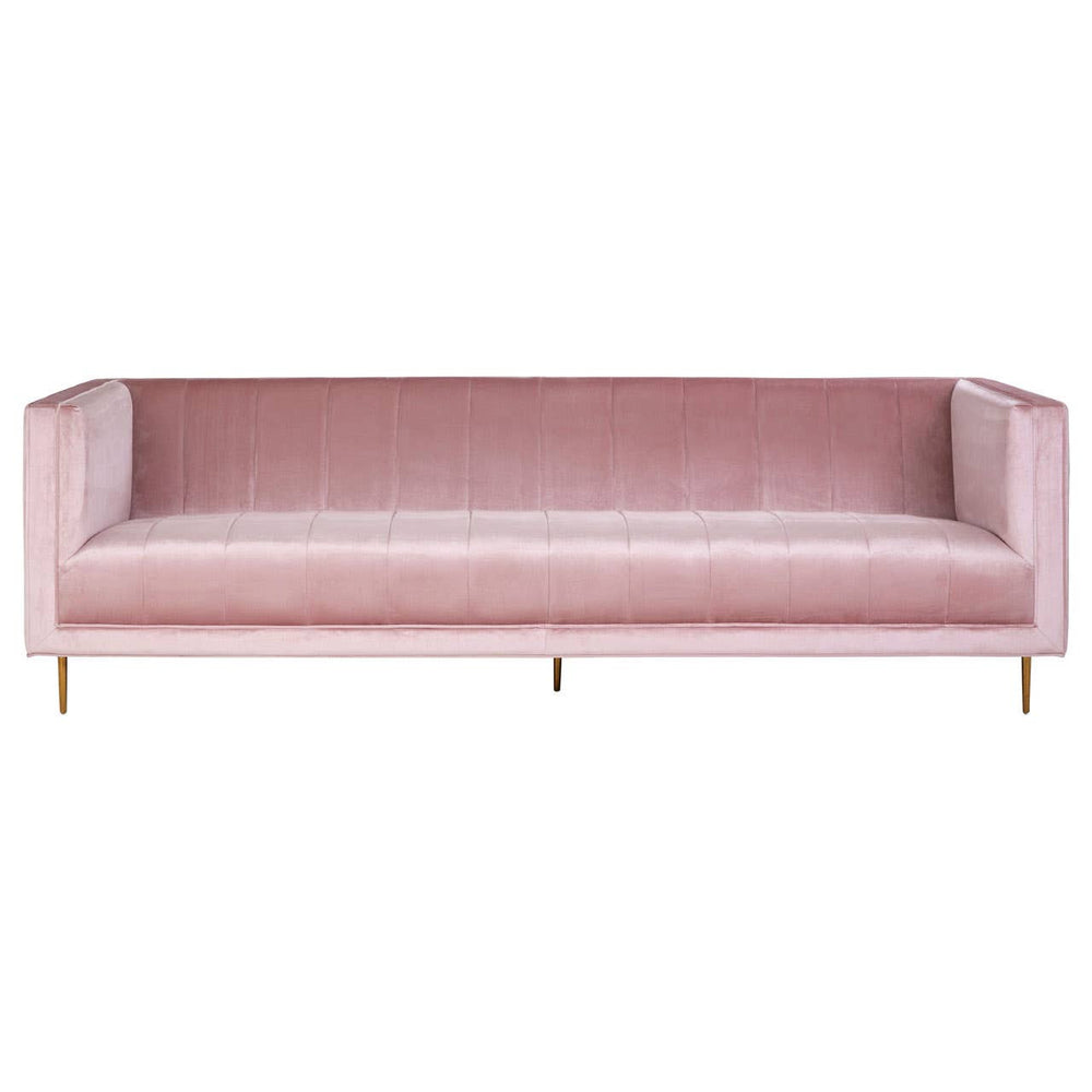 A three-seat sofa upholstered in soft pink fabric, featuring a minimalist design with clean lines and no visible armrests. The sofa is supported by sleek, golden metal legs, adding a modern touch to its overall aesthetic