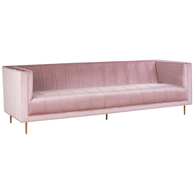 Three-seat sofa upholstered in soft pink fabric with a sleek, modern design. The sofa features a straight back and arms, providing a minimalist aesthetic. It is supported by slender, gold-colored legs, adding a touch of elegance to the overall look