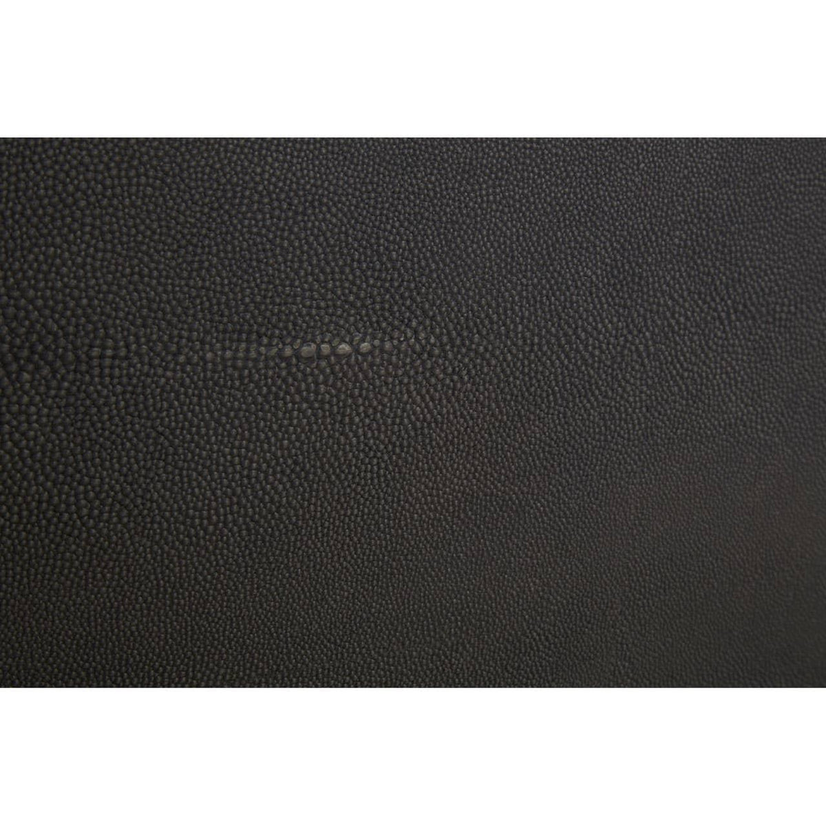 Close up of black textured leather upholstery surface for furniture
