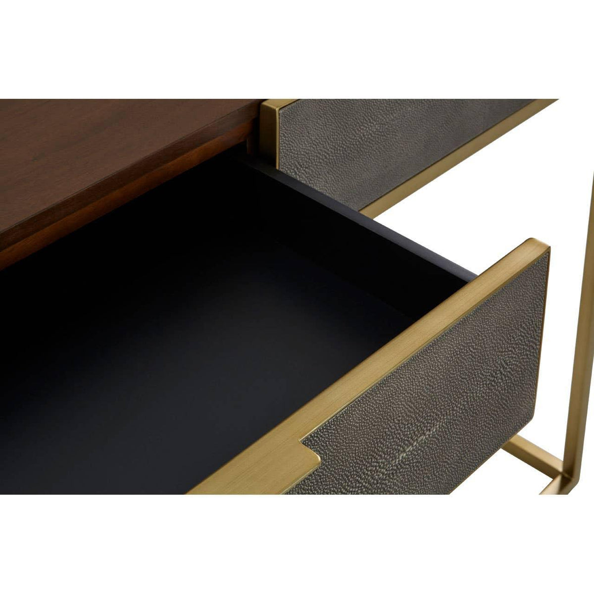 Close view of open sideboard drawer with textured grey front and gold trim