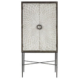 Milan Two Door Elm Wood Wine Cabinet featuring a textured front with a circular handle, supported by slender metal legs in a crossed design. The cabinet has a natural wood finish, showcasing the grain of the elm wood