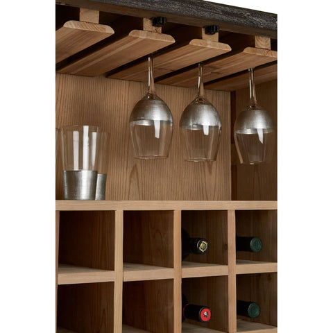 Milan Two Door Elm Wood Wine Cabinet featuring a natural wood finish, multiple wine bottle compartments, and a hanging rack for wine glasses. The interior showcases a warm, inviting design with a smooth texture and ample storage space