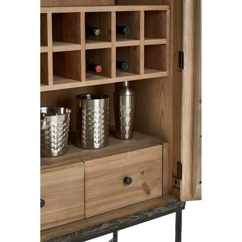 The interior of the Milan Two Door Elm Wood Wine Cabinet features a wooden structure with multiple compartments for wine bottles, a pair of silver-colored cocktail shakers, and two drawers at the bottom for additional storage. The cabinet has a natural wood finish, showcasing the grain of the elm wood