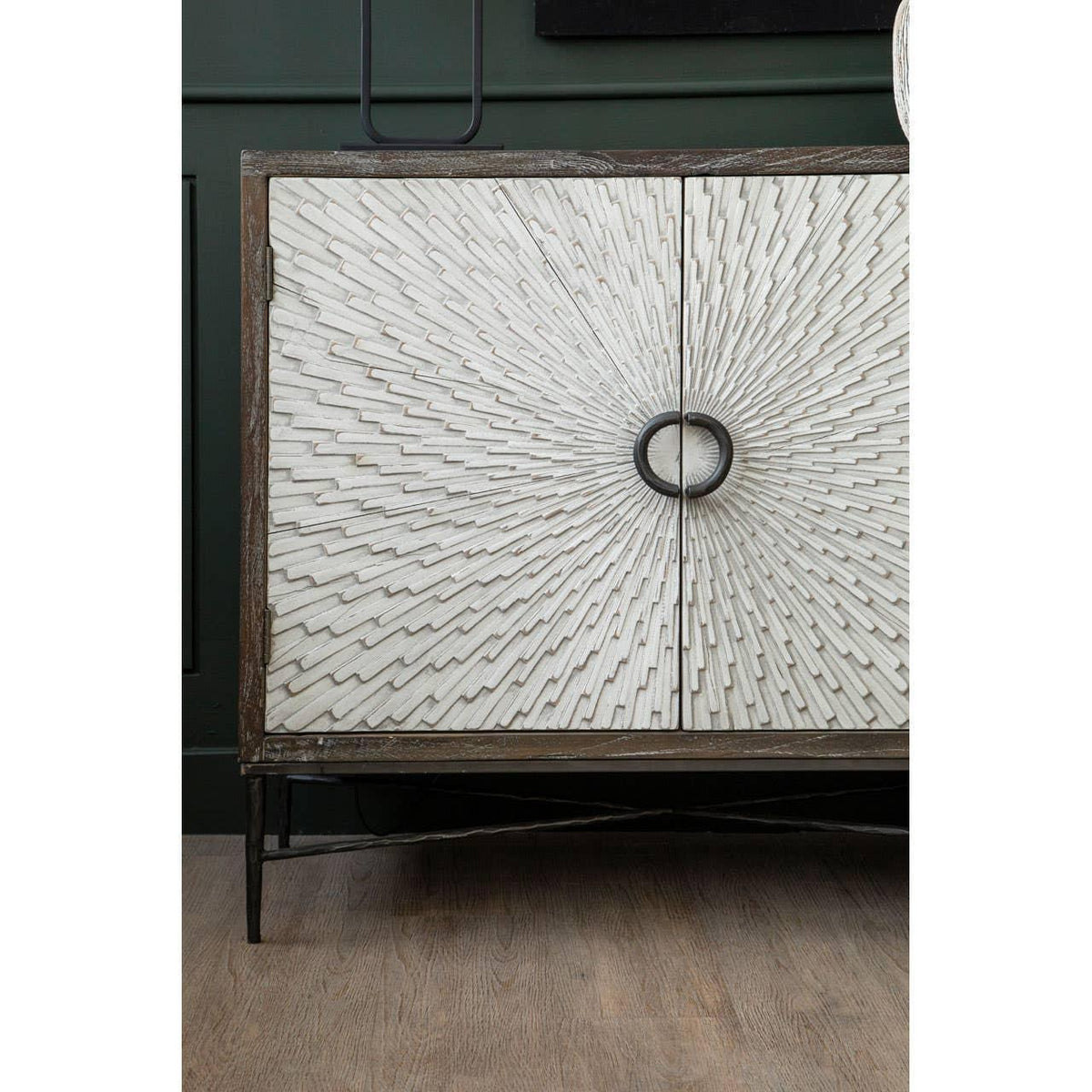 Textured wood sideboard with sunburst pattern doors and black metal handles