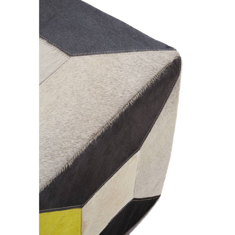 Geometric design pouffe featuring a combination of hair-on leather in shades of black, cream, and yellow, showcasing a textured surface with angular patterns