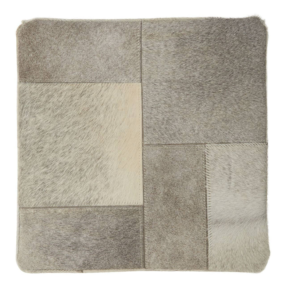 Square pouffe featuring a patchwork design in various shades of grey, with soft textures and a contemporary aesthetic, suitable for home decor