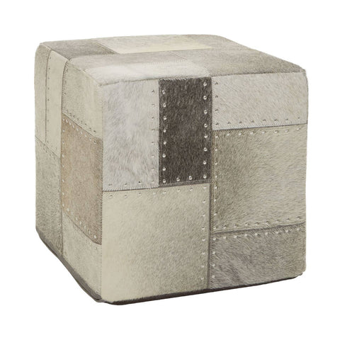 Square pouffe featuring a patchwork design in various shades of grey, with textured fabric and decorative stitching details