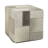 Square pouffe featuring a patchwork design in various shades of grey, with textured fabric and decorative stitching details