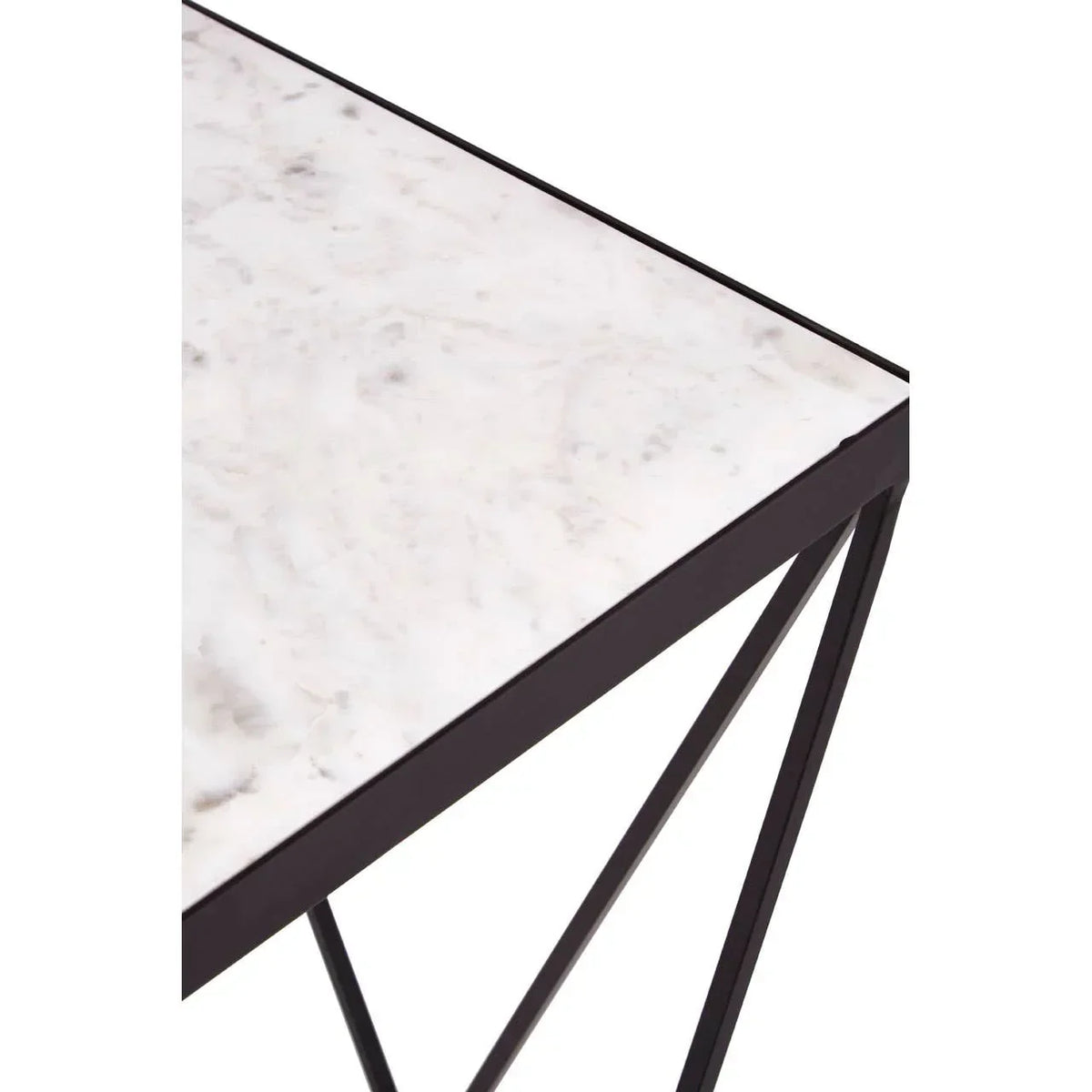 White marble top table with black metal legs, close-up of corner and frame design