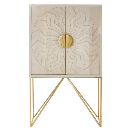 White wash mango wood cabinet featuring intricate leaf patterns on the front, complemented by a round gold handle. The cabinet stands on a sleek, geometric gold metal base, adding a modern touch to its design
