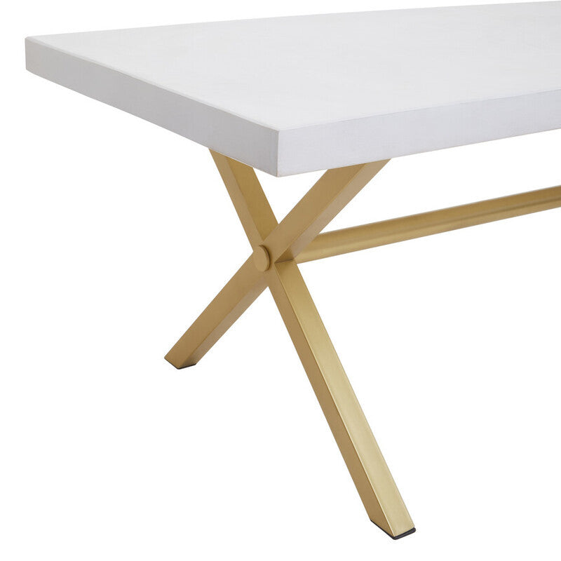 A white wash mango wood dining table featuring a smooth rectangular top and a sturdy, crossed wooden base in a natural finish. The design emphasizes clean lines and a modern aesthetic, suitable for various dining spaces