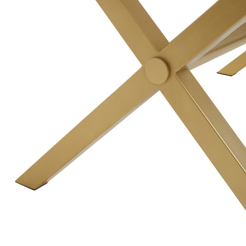 Close-up view of the cross-legged base of a dining table made from white wash mango wood, showcasing the natural grain and texture of the wood. The legs are positioned in an X shape, providing stability and a modern aesthetic