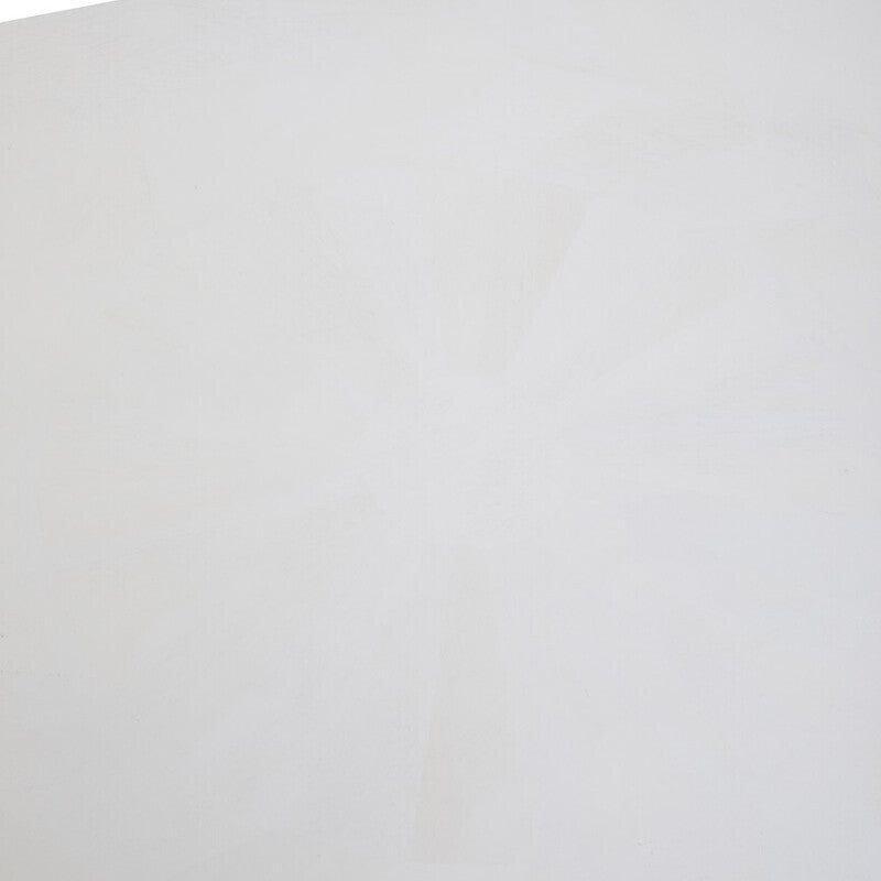 A close-up view of the surface of a white wash mango wood dining table, showcasing a smooth, light-colored finish with subtle wood grain patterns. The edges are slightly rounded, enhancing the table's modern aesthetic