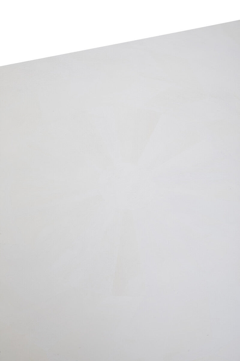 A close-up view of the surface of a white wash mango wood dining table, showcasing a smooth, light-colored finish with subtle wood grain patterns. The edges are slightly rounded, enhancing the table's modern aesthetic