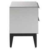 Two-drawer chest featuring a sleek, modern design with a light gray finish and contrasting black legs. The chest has a minimalist aesthetic, with clean lines and a flat top surface suitable for decorative items or lamps