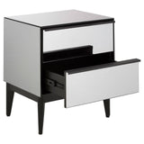 A modern two-drawer chest featuring a sleek mirrored front and a black frame, with one drawer partially open to reveal a spacious interior. The chest stands on four tapered legs, adding a contemporary touch to home decor