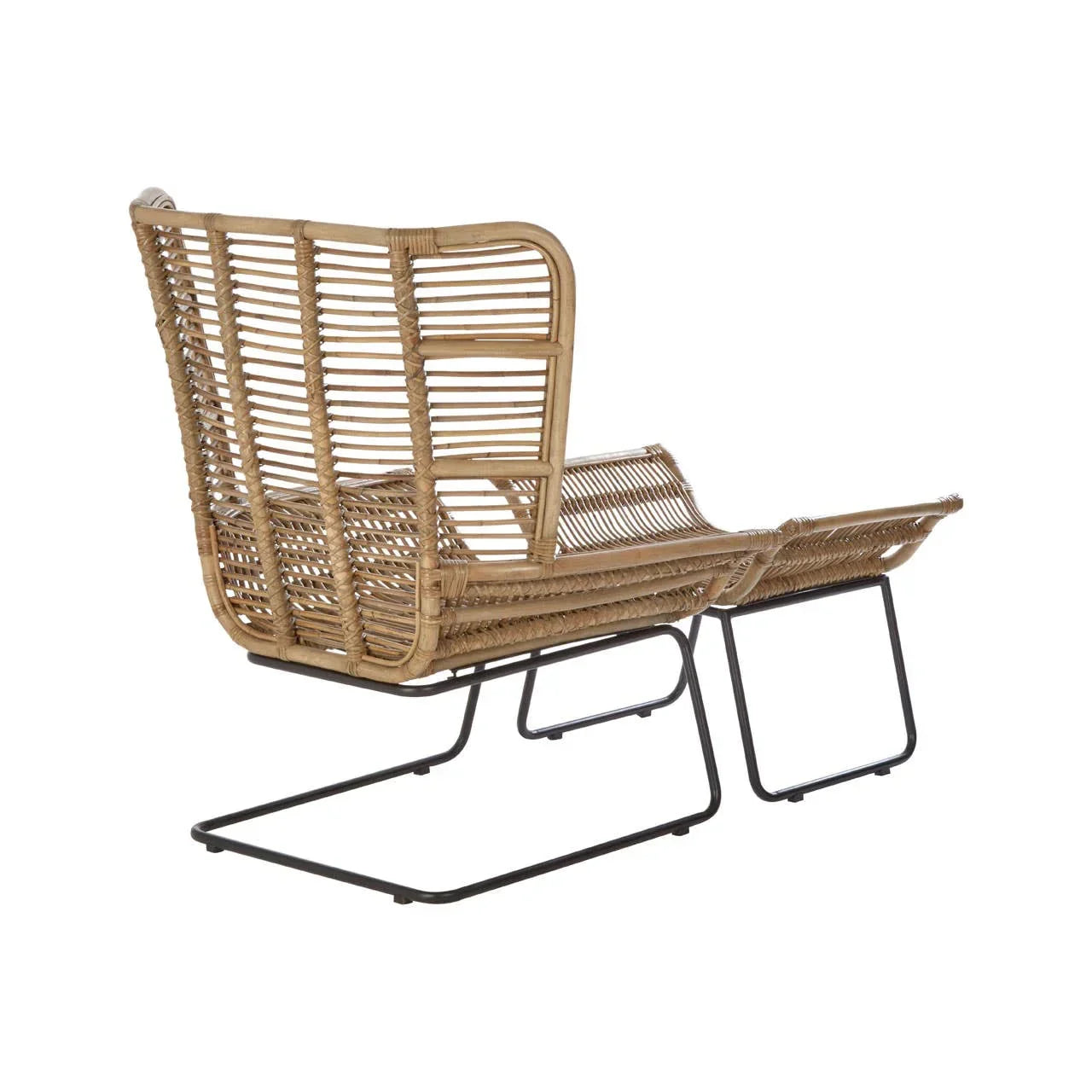 Rattan lounge chair with matching ottoman and black metal legs, rear angle view