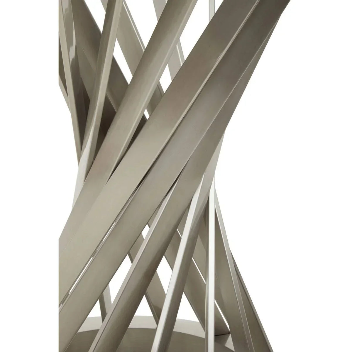 Close view of metal dining table base with interlaced brushed steel slats