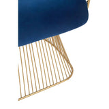 Blue velvet seat with gold metal wire frame chair base, close-up angle