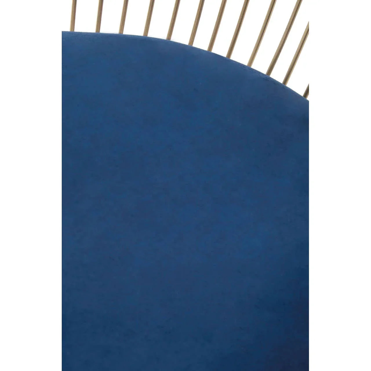 Blue velvet dining chair seat with gold metal back detailing close up