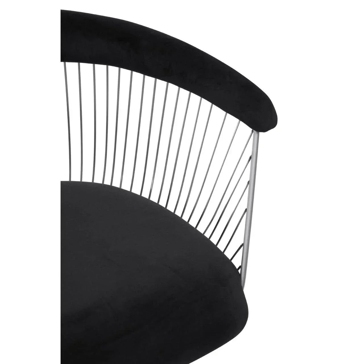 Black velvet armchair with metal wire backrest and curved seat detail