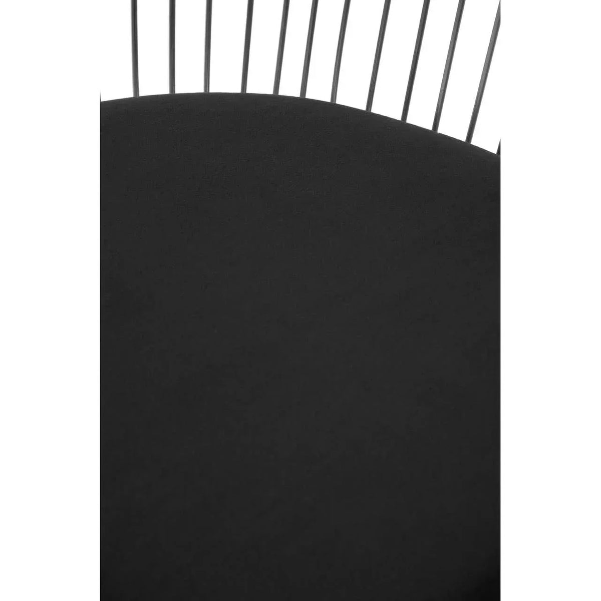 Black metal chair seat with vertical rod backrest detail, close up view