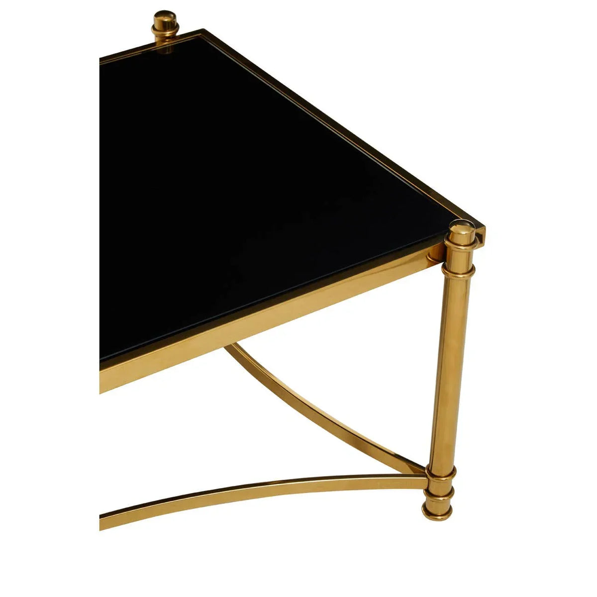 Black glass coffee table corner with gold metal frame and curved leg supports