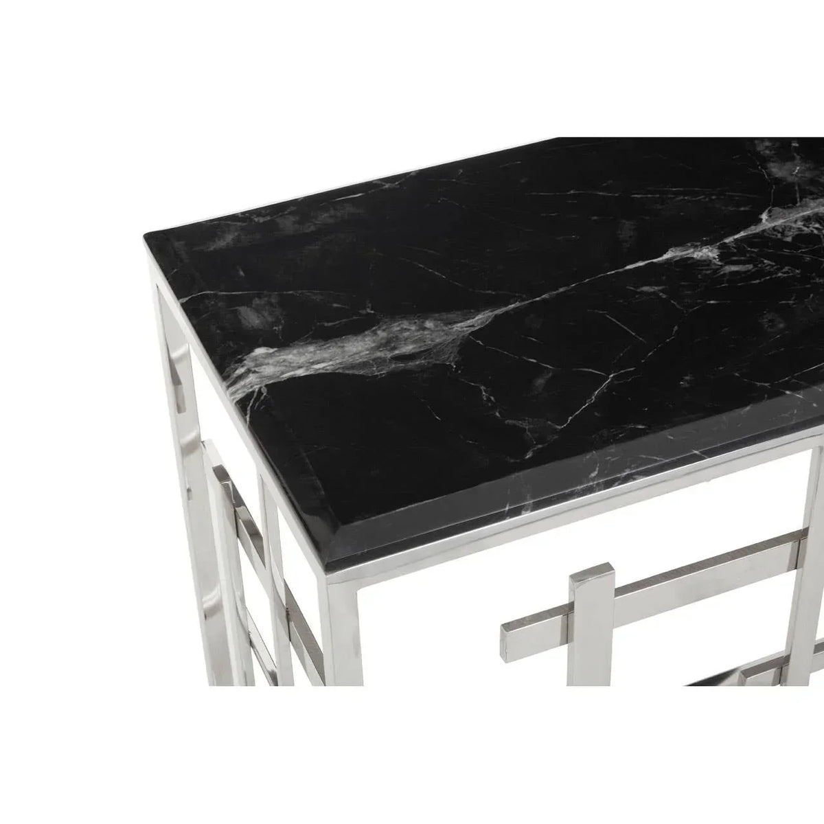 Rectangular black marble top table with chrome metal frame, close-up view
