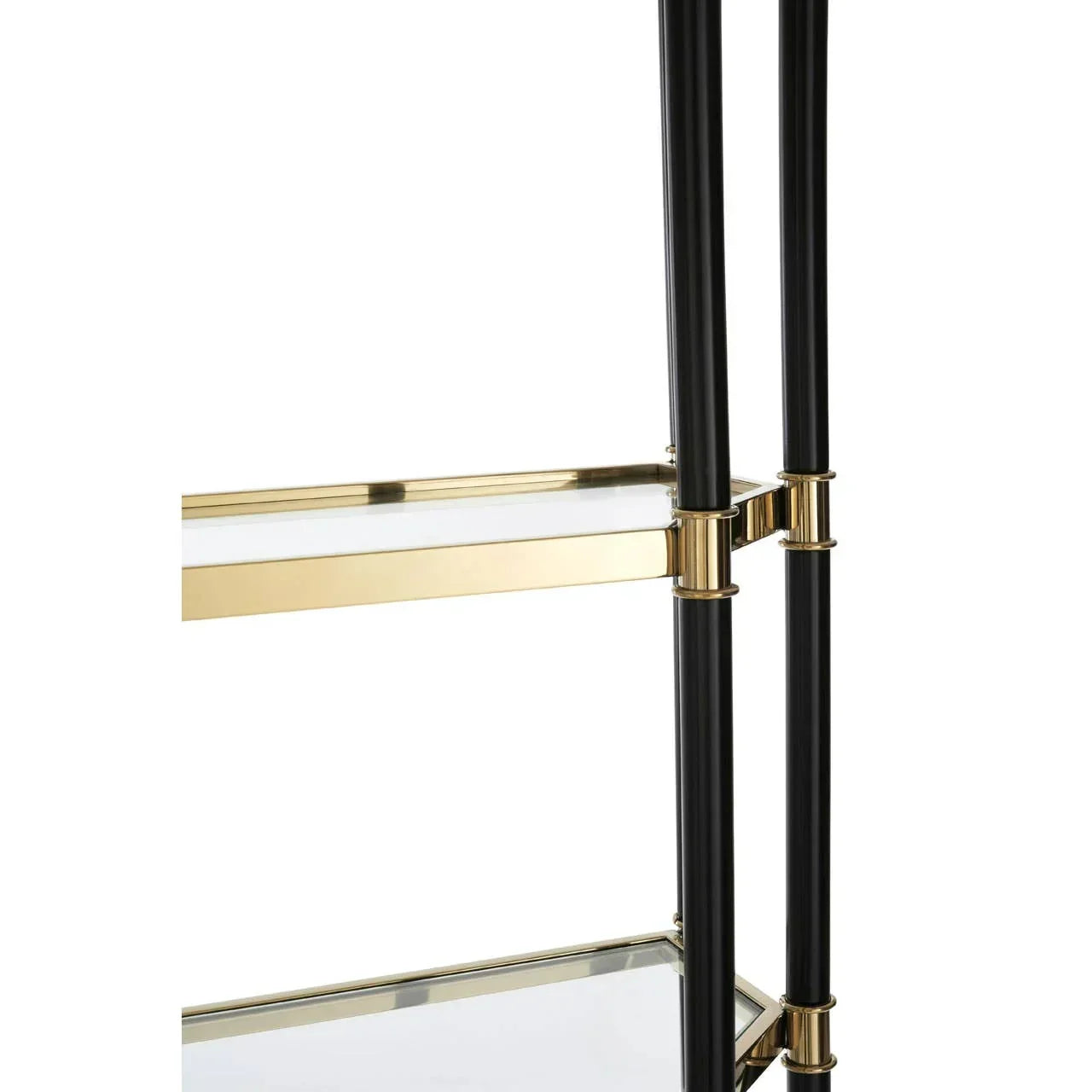 Black and gold shelving unit with glass shelves, close-up of frame and connectors