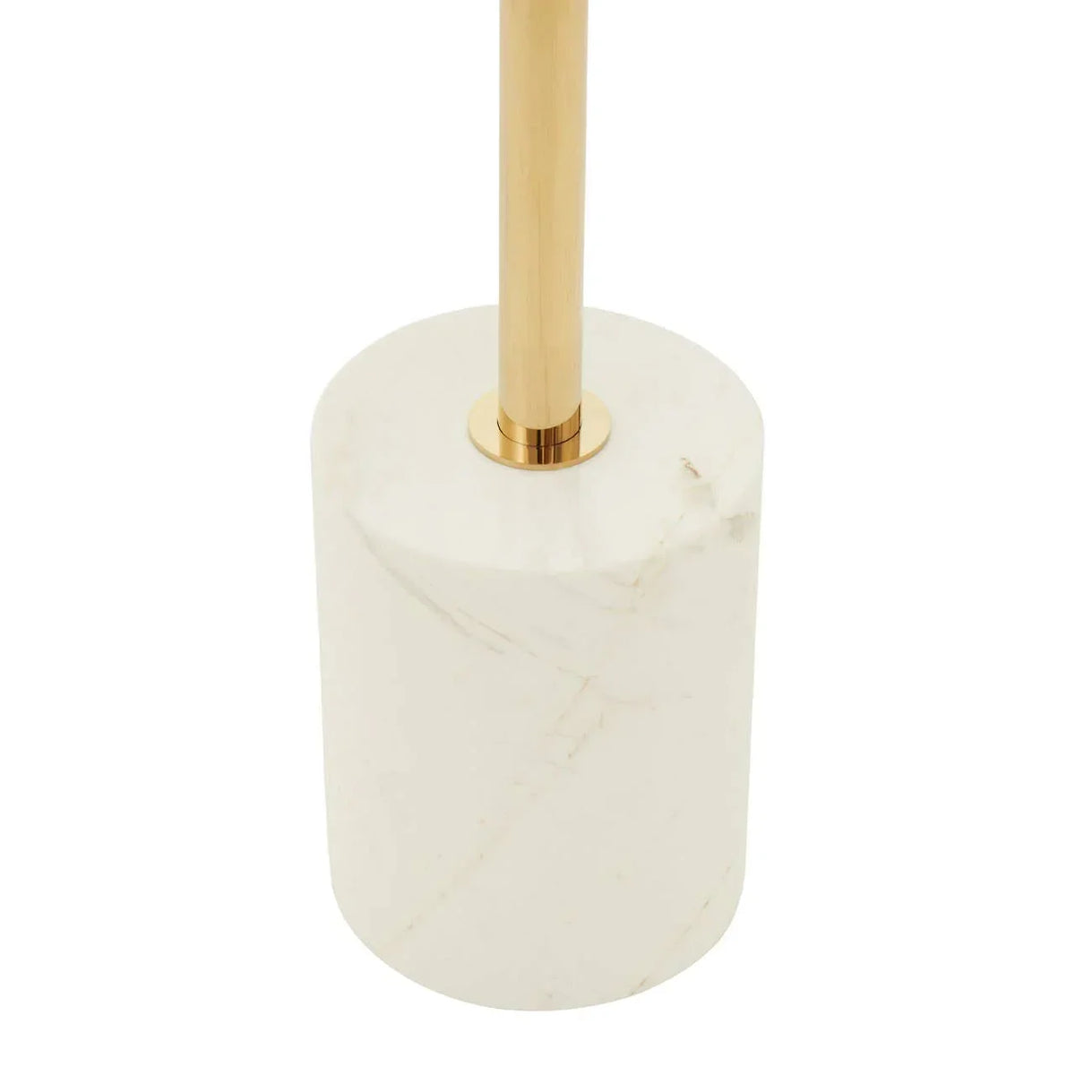 Gold floor lamp with white marble cylindrical base, close-up of base and stand