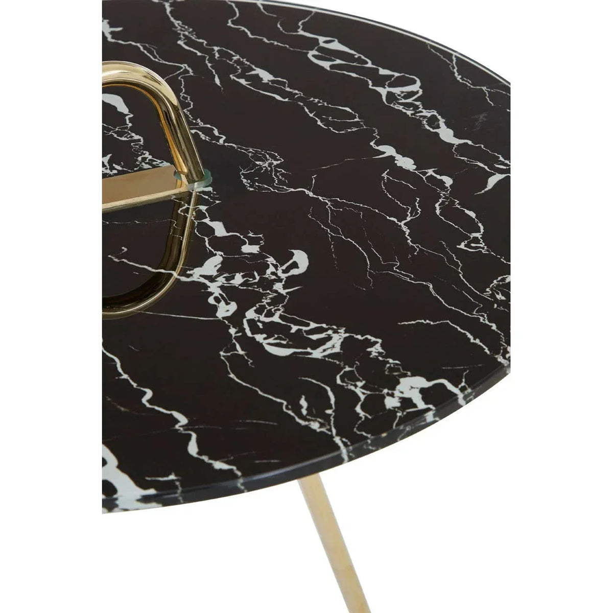 Round black marble side table with gold metal handle and legs, close-up of tabletop