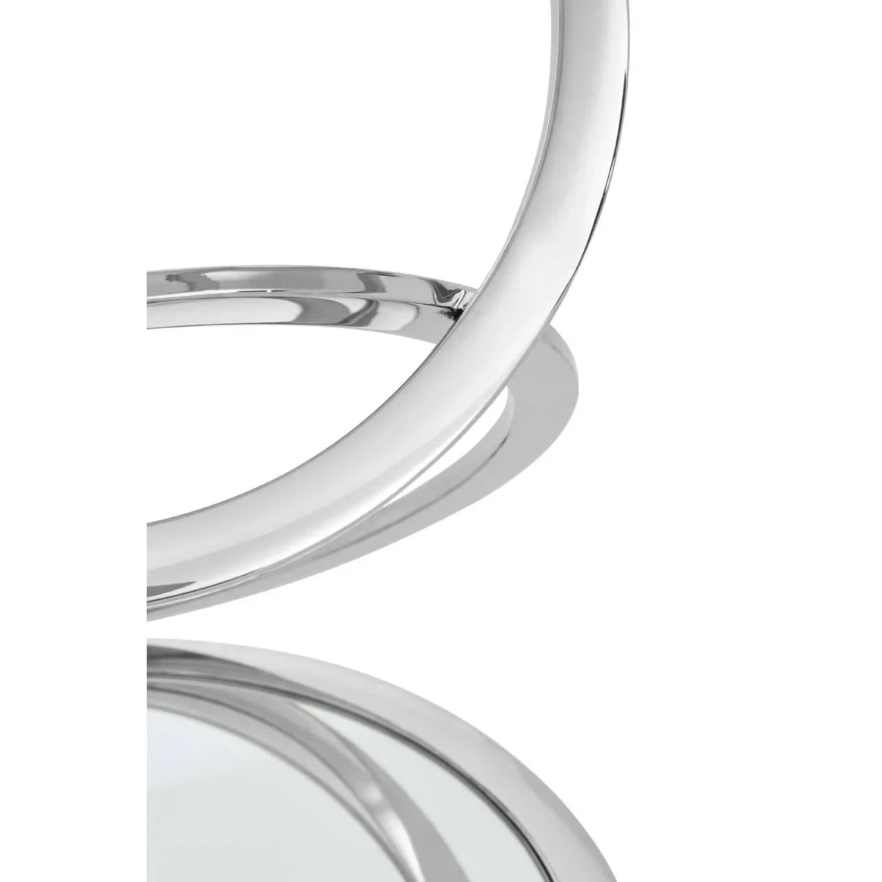 Close-up of chrome metal round coffee table frame with mirrored glass top