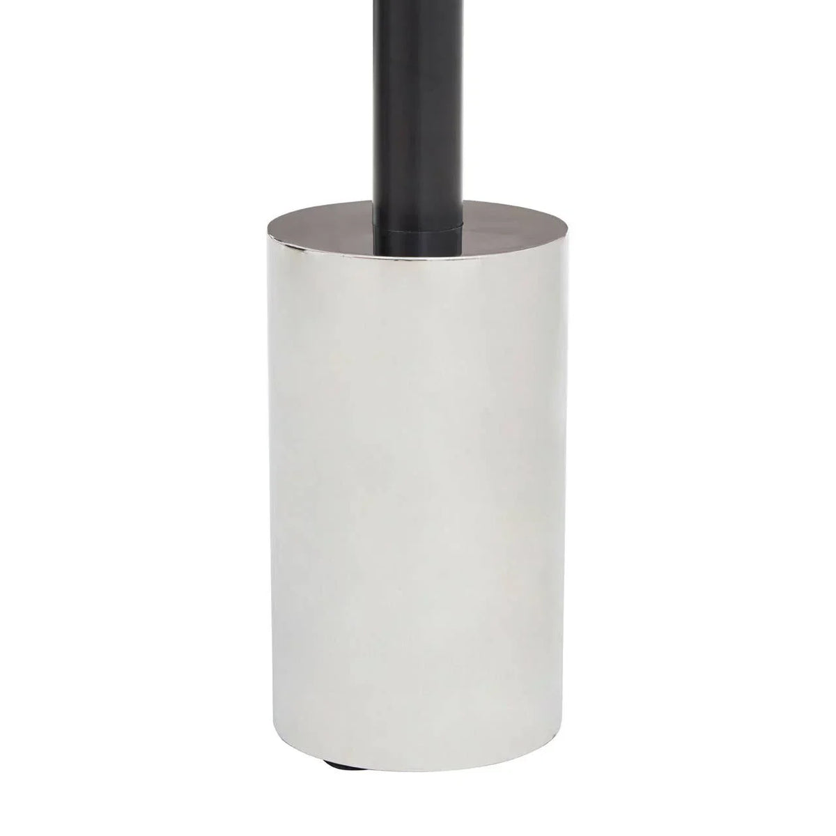 Chrome cylindrical metal lamp base with black pole detail, close-up view