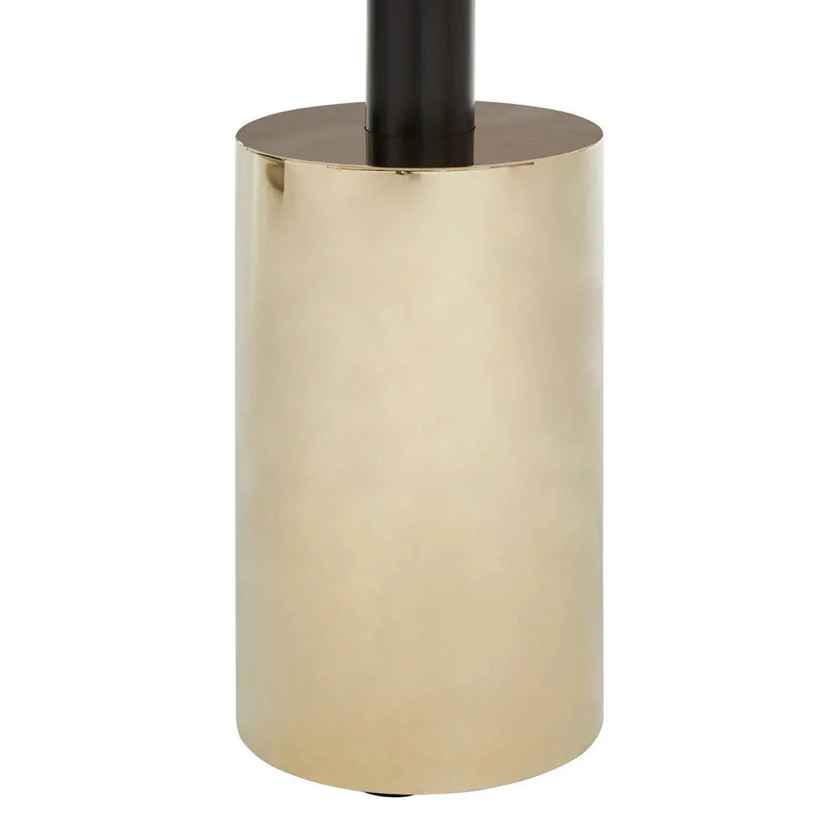 Gold cylindrical metal lamp base with black vertical stem, close-up furniture detail