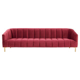 Three-seat sofa upholstered in rich wine-colored velvet, featuring vertical tufting along the backrest and smooth, rounded arms. The sofa is supported by sleek, golden metal legs, adding a modern touch to its elegant design