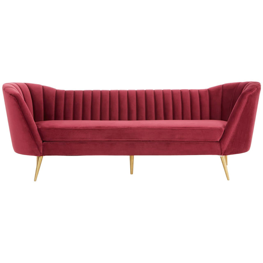 Three-seat sofa upholstered in rich wine-colored velvet, featuring a channel-tufted backrest and sleek, angled arms. The sofa stands on slender gold metal legs, adding a touch of elegance to its modern design
