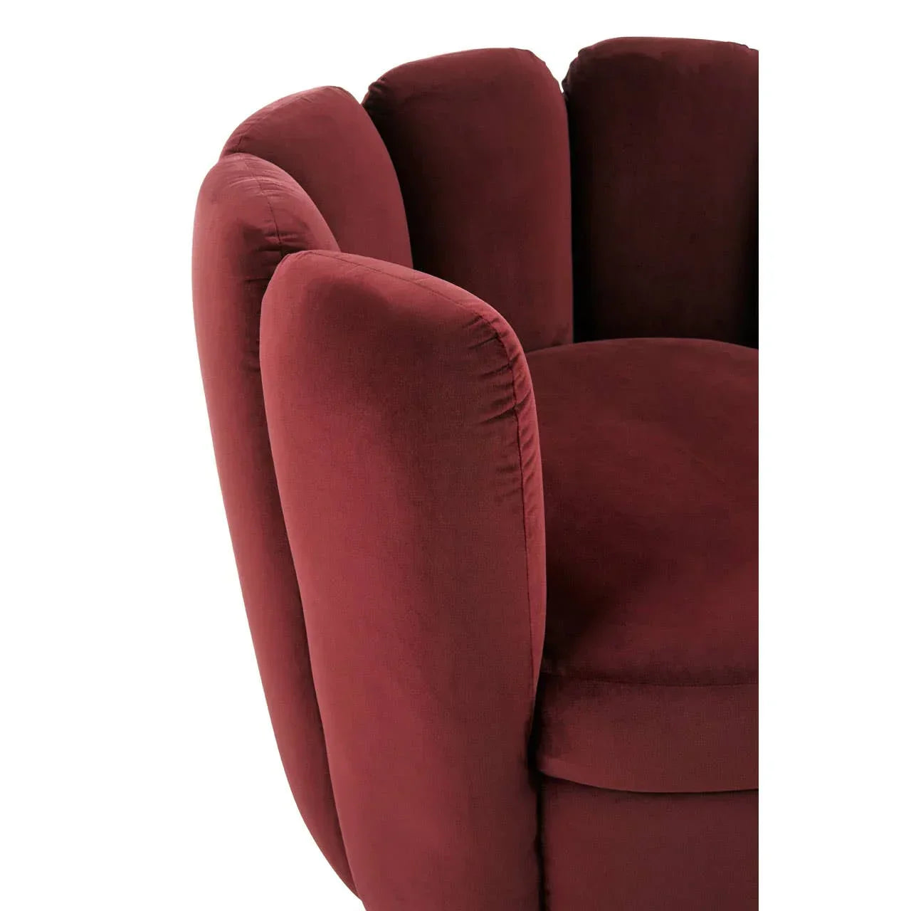 Plush velvet armchair in dark red with petal-shaped backrest close-up